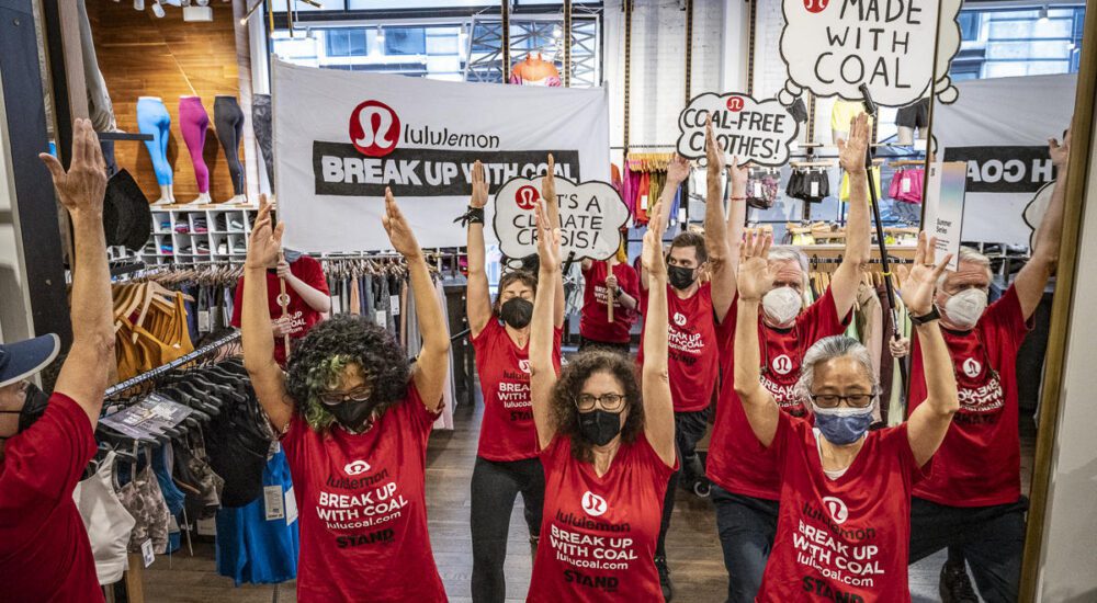 Climate protestors demonstrating inside a lululemon store.