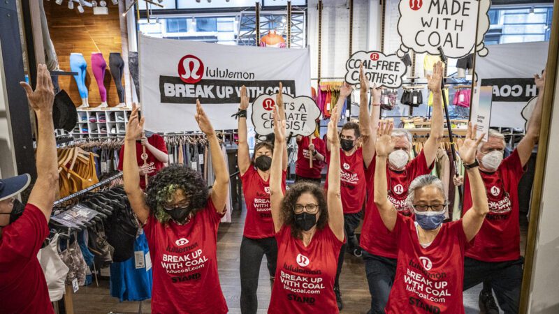 Climate protestors demonstrating inside a lululemon store.