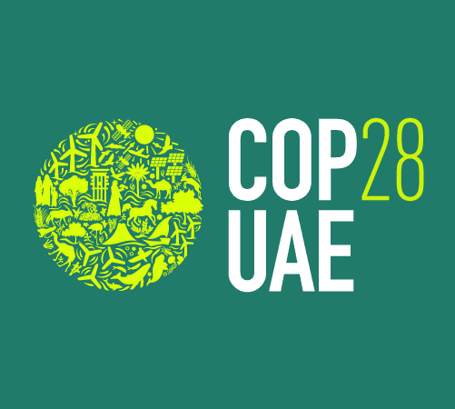 COP28 UAE written in white bold text with a green cirlce with little icons inside of the circle against a green background.