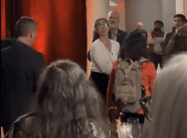 Peaceful protestor disrupts BC NDP fundraising convention.